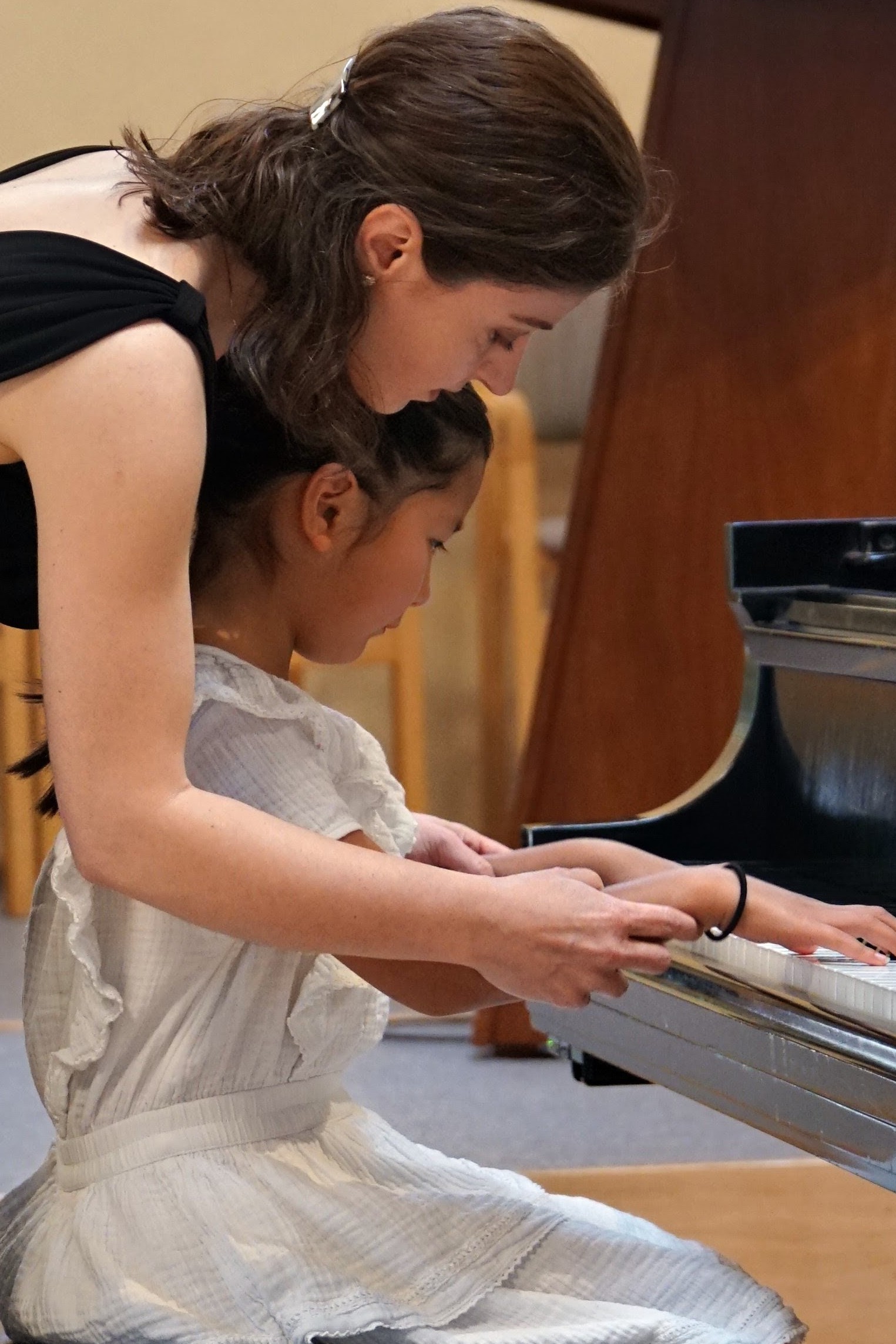 Student performing at a piano recital